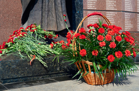 Tiraspol, Transnistria - September 2, 2020: date 30th anniversary of independence, flowers on the memorial to fallen soldiers, Russian text with different namesのeditorial素材