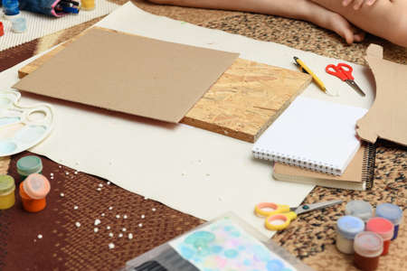watercolor paints and paper closeup for drawing, artistic creation at home, workspace for make creative artworkの写真素材