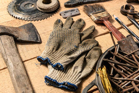 Old vintage household hand tools still life on a wooden background in a DIY and repair concept