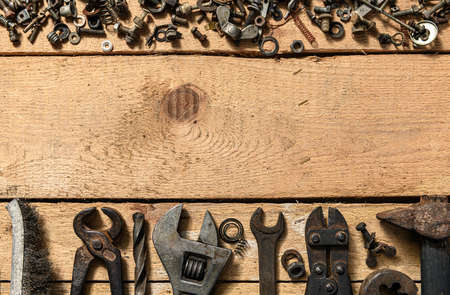 Old vintage household hand tools still life on a wooden background with copyspace and place for text
