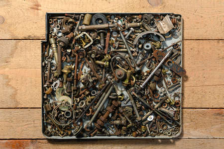 background from old vintage hand tools - set of different screws and nuts