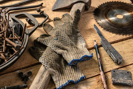 Old vintage household hand tools still life on a wooden background in a DIY and repair conceptの写真素材