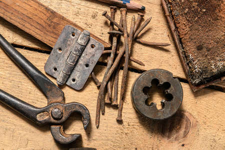 Old vintage household hand tools still life on a wooden background in a DIY and repair conceptの写真素材
