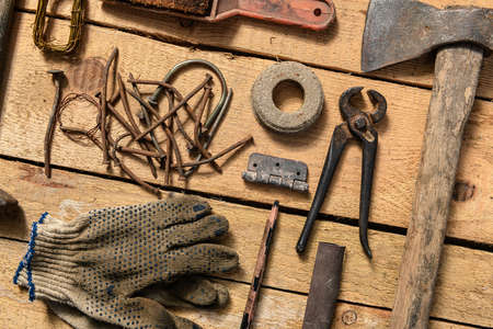 Old vintage household hand tools still life on a wooden background in a DIY and repair concept
