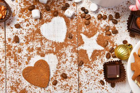 sweet food top view background for merry christmas or new year holiday decoration - chocolate candies, tangerines, cookies, marshmallow and cocoa latte on white woodの写真素材