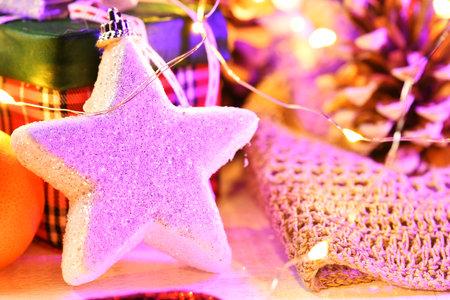 decoration background for merry christmas or new year holiday with night illumination - chocolate candies, tangerines, cookies, marshmallow and cocoa latte on white woodの写真素材