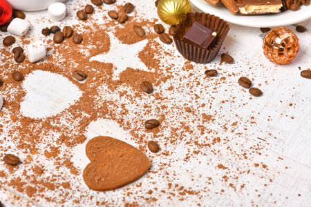 sweet food top view background for merry christmas or new year holiday decoration - coffee beans, heart and star shapes from cocoa powder on white woodの写真素材