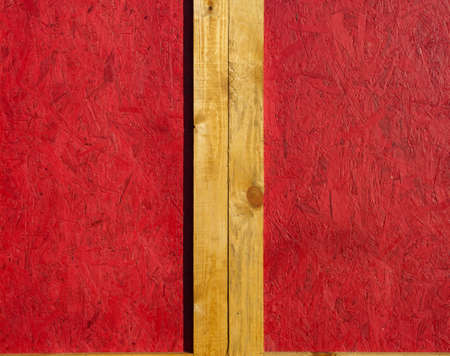 wooden wall with frame and blank space - the yellow wooden planks is on red wood background, new and clean surfaceの写真素材