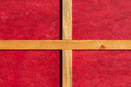 wooden wall in German or Scandinavian style - the yellow wooden planks is on red wood background, new and clean surfaceの写真素材