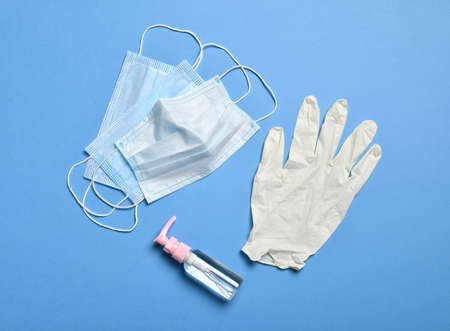 medical protective face mask for respiratory protection against germs, covid or coronavirus, and syringe with hand sanitizerの写真素材