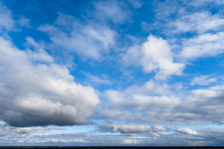 beautiful blue sky and bright clouds as abstract backgroundの写真素材