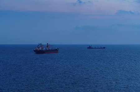 sunset, ships at sea, seascape with blue sky