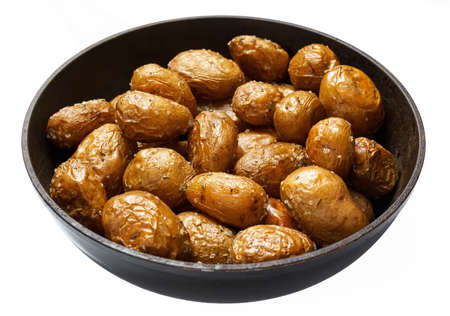 roasted potatoes in a frying pan, whole cooked food, delicious crust, one object isolated on a white backgroundの写真素材