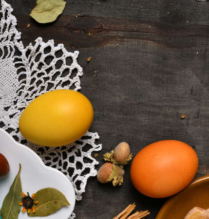 easter holiday still life and decorations, easter eggs on a black wooden background