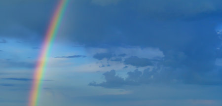 beautiful blue sky with rainbow in the evening as abstract background