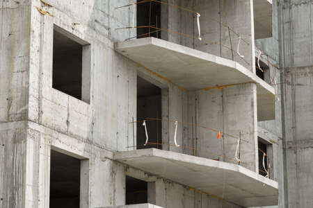 construction of a modern high-rise building of residential complex, the creation of a concrete frame, building materialsの写真素材