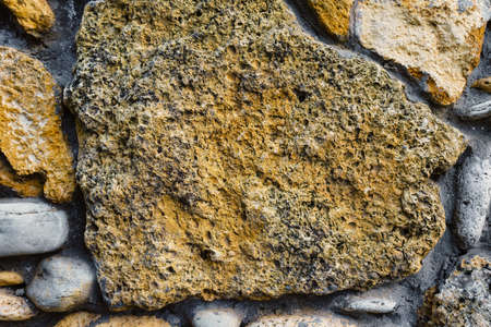 a wall made of decorative stone as a background or texture