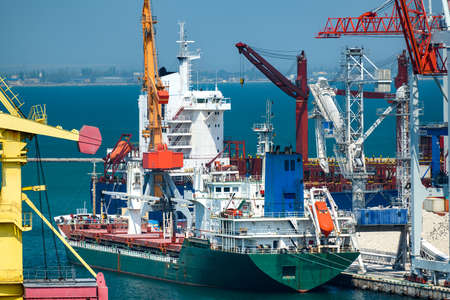 industrial seaport infrastructure, sea, container ship and cranes, commercial dock with container...