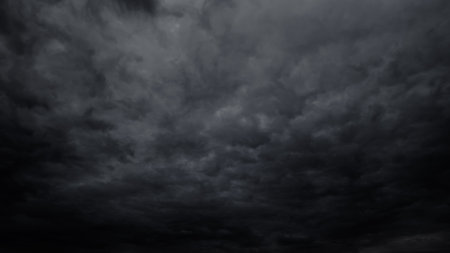 dark dramatic sky with stormy clouds before rain or snow as abstract background, extreme weather