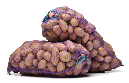 two bags of potatoes, objects isolated on a white backgroundの写真素材