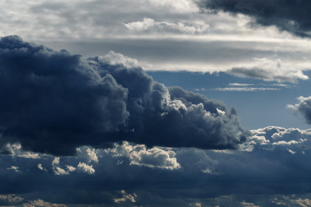 storm sky, dark dramatic clouds during thunderstorm, rain and wind, extreme weather, abstract...