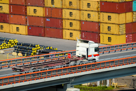 seaport, Odessa, Ukraine, May 4, 2019 - truck transports container through industrial seaport,...