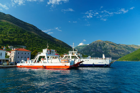 Lepetane - Kamenari Ferry, Montenegro, June 30, 2023 - the sea ferry transports cars and passengersのeditorial素材