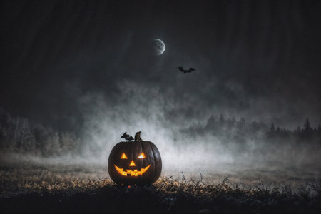 pumpkin head glows in the dark forest at night, scary and mystical, Halloween concept, the moon shines through the fog, black silhouettesの素材