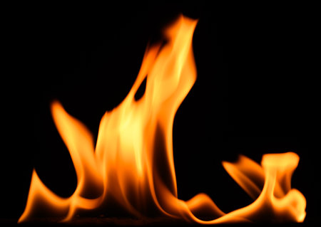 fire on a black background, burning and hot flames, close viewの写真素材