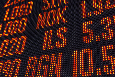 digital scoreboard with currency names and numbers for the exchange rate of financial transactions and exchangesの写真素材