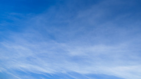 beautiful blue sky with soft white clouds for abstract backgroundの写真素材