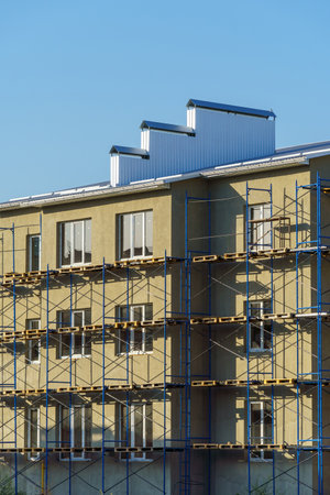 a construction site with a house under construction against the skyの写真素材