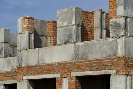 a construction site with a house under construction against the skyの写真素材