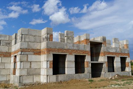 a construction site with a house under construction against the skyの写真素材