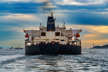A large tanker ship sails along the Bosphorus against the background of Istanbul, Turkey, a view from a pleasure boatの写真素材