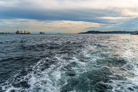 view from a pleasure boat on the Bosphorus and the cityscape of Istanbul, Turkey, the architecture of the city, a popular tourist destination.の写真素材