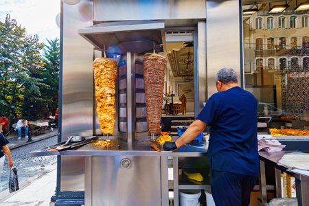 meat for shawarma is grilled, near the cook, Istanbul city street, Turkeyの写真素材