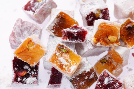 Sweet food Turkish delight, assorted rahat locum in form of cubes with nuts and powdered sugar, traditional food, on white backgroundの写真素材