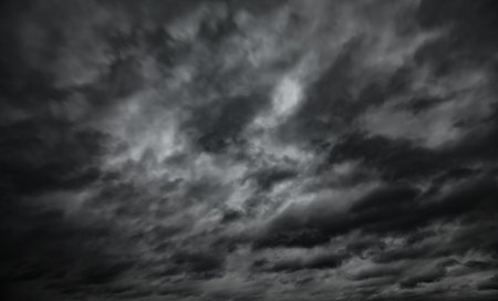 dark dramatic sky with black stormy clouds before rain as abstract background, extreme weather.の写真素材