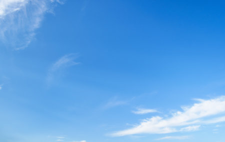 beautiful blue sky with soft white clouds for abstract background.の写真素材