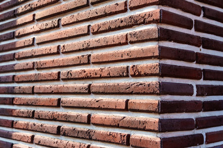 close up view of decorative brick wall corner for background or texture, building facade