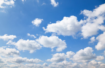 A beautiful blue sky with soft, white clouds, for an abstract backgroundの写真素材