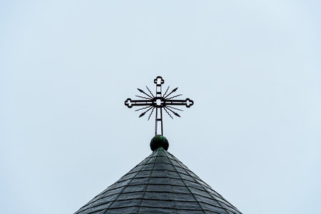 Orthodox cross on the dome of the church against the sky, monastery Neamt, Romaniaの写真素材