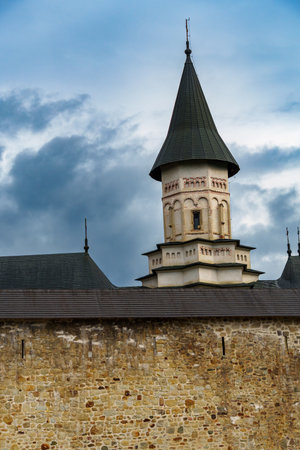 facade of the Bistrita Orthodox Monastery, Romania, view of the walls and towers ancient...