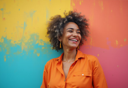 Portrait of a woman standing against a wall, painted in bright, multi-colored paintsの素材