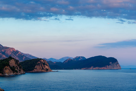 beautiful sunset over Adriatic sea, rocky coast, beautiful landscape of Montenegroの写真素材