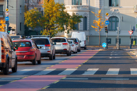 View of city streets and square, architecture, houses and traffic, random people on the sidewalk, city life in Budapest, Hungary, Heroes Squareの写真素材