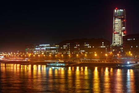 Panoramic view of Budapest city and the Danube River at night, urban architecture with beautiful illumination, street lights and road trafficの写真素材