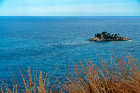 Panoramic view of the sea and island, bright sky and horizon over water, concept of summer vacation...