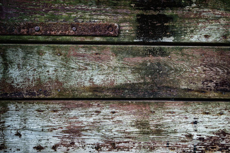 old weathered and cracked boards painted red and green color for background or texture